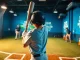 Young player practicing at the hit club, swinging a bat with determination in a vibrant training facility.