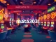 Experience the thrill of gaming at mata303 with vibrant slot machines and engaged players.